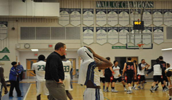 Boys varsity basketball loses to TJ; girls advance to district championship