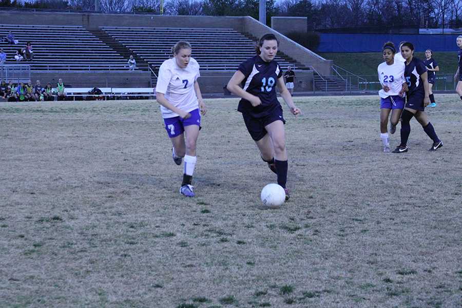 Senior Ellen Gose chases down an oppenent during a varsity girls soccer game against Stone Bridge last season. Gose, who has played varsity soccer at South Lakes since her freshman year, committed to College of Charleston for Division I soccer.