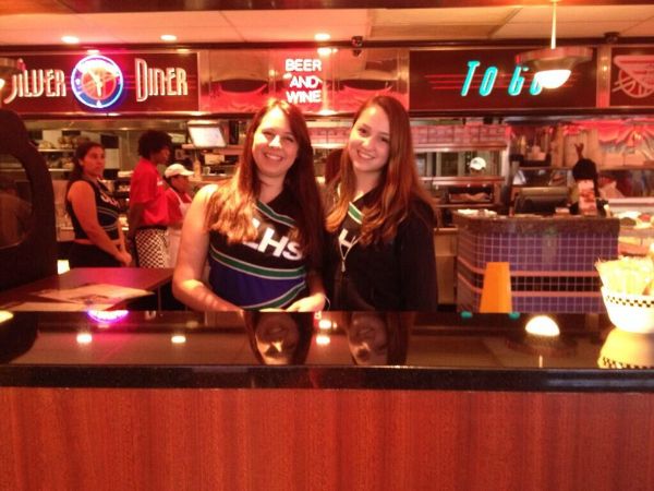 Dance team members play hostess at Silver Diner during a team fundraiser.