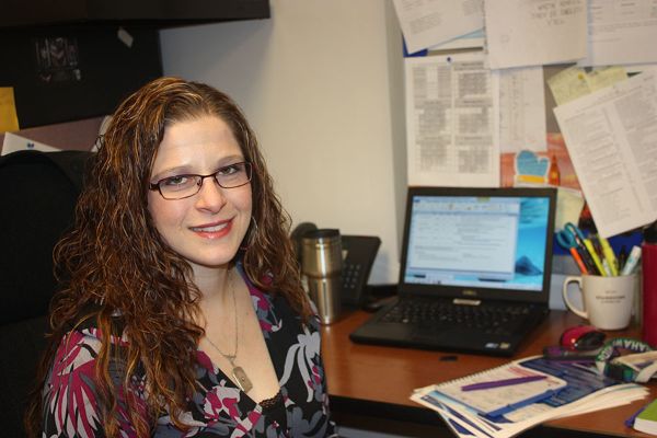 International Baccalaureate Middle Years Program coordinator Dana Lieberman sits at her desk in the IB office. 