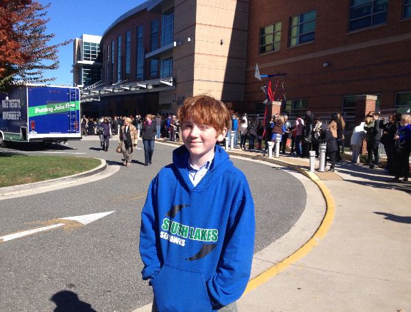 Future Seahawk Aidan Kropp-Sullivan waits outside of Washington-Lee High School for Virginia gubernatorial candidate Terry McAuliffe's rally. 