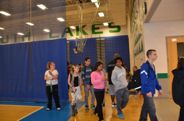 Freshmen leave the gym after finishing  their mentoring program.
