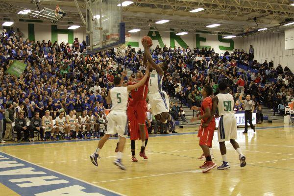 Varsity basketball player Brandon Kamga goes up for a shot in the Feb. 8 game against Stone Bridge last season.
Kamga, who averaged 17.6 points per game last season goes into his junior season with offers from several colleges
including Howard University, Radford, and James Madison.