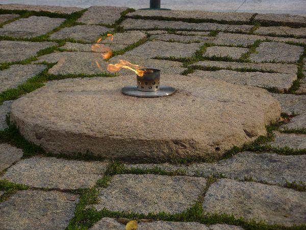 The John F. Kennedy Eternal Flame burns on at the presidential memorial at the gravesite of U.S. President John F. Kennedy, in Arlington National Cemetery.