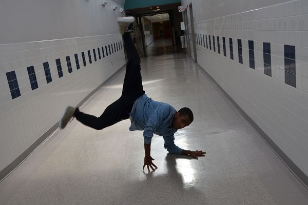 Junior Robel Makaveli shows off dance moves in the hallway. 