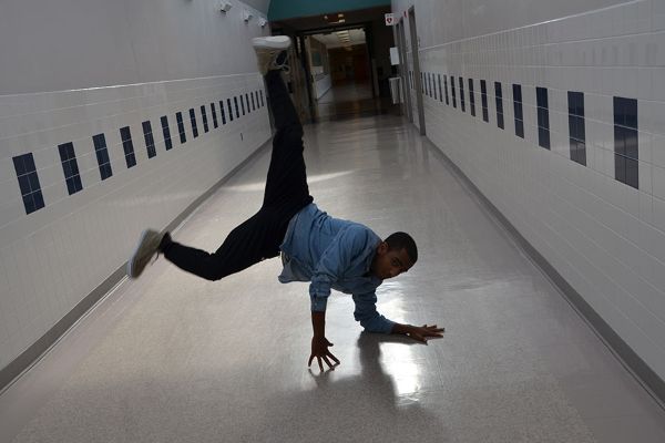 Junior Robel Makaveli shows off dance moves in the hallway.