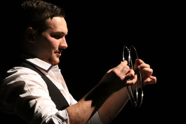 Alum Derek Jasper (Wahdan) during his second to last magic trick during his one-man Show on Feb. 7