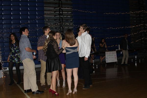 Students+socialize+at+the+beginning+of+the+Sadie+Hawkins+Dance+Feb.+7.+The+dance+started+at+8%3A00+p.m.+and+ended+at+11%3A00+p.m.