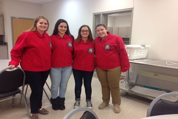 Seniors Georgia corey, Samantha Klonaris, Maria Ingea, and Herndon Academy student Jennifer Bagby competed in the Entrepreneurship Team category at SkillsUSA district contest Feb. 1.