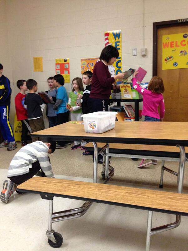 Terraset Elementary School students wait in line to read books during the Readers are Leaders session held Feb. 5. This is the baseball teams first year with the program.