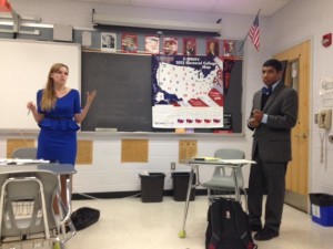 Sophomore Kiran Hampton is cross-examined by Maret School senior Miriam Pierson during the WACFL Metro Finals championship round debate. 