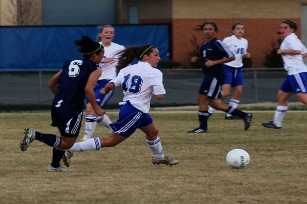 Christopher participates in a soccer game.