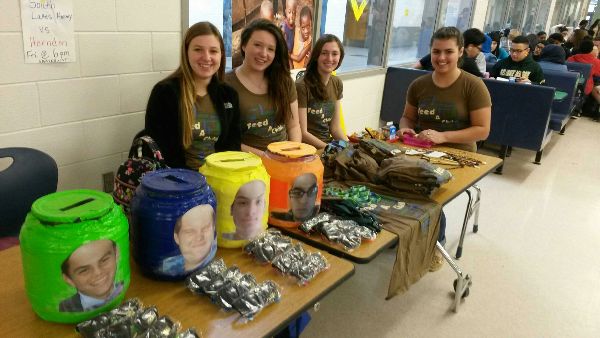 Key Club members sell Feed A Child lanyards and shirts to raise money for the campaign.