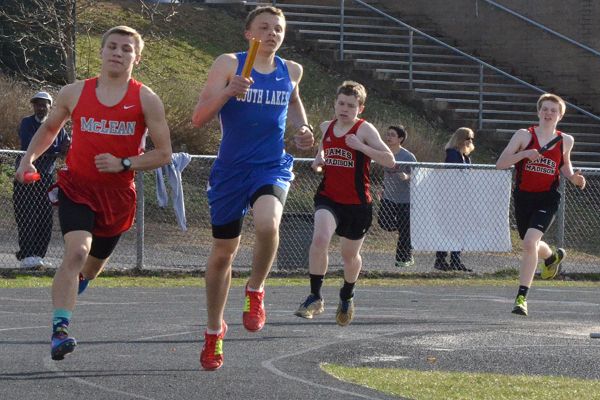 Freshman Ashton Reinhold runs in the 4x800 meter relay at the junior varsity meet on April 2. South Lakes hosted Madison, McLean, and TJ.