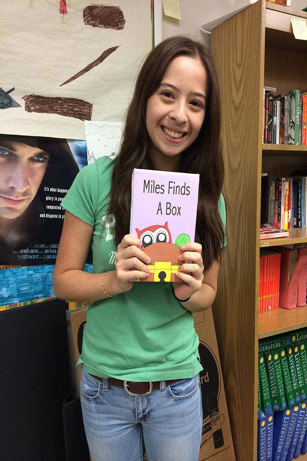 Sophomore+Christine+Sullivan+holds+her+picture+book.