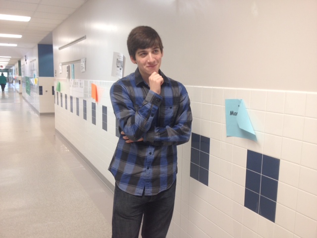 Philosophy Club founder Julian Levy-Myers assumes "The Thinker" pose. 