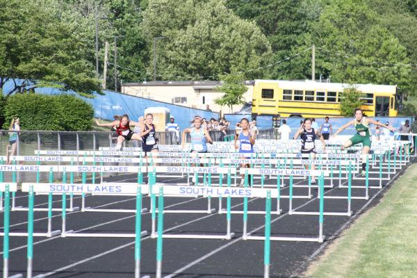 Outdoor track members competed in a hurdle meet last year. 