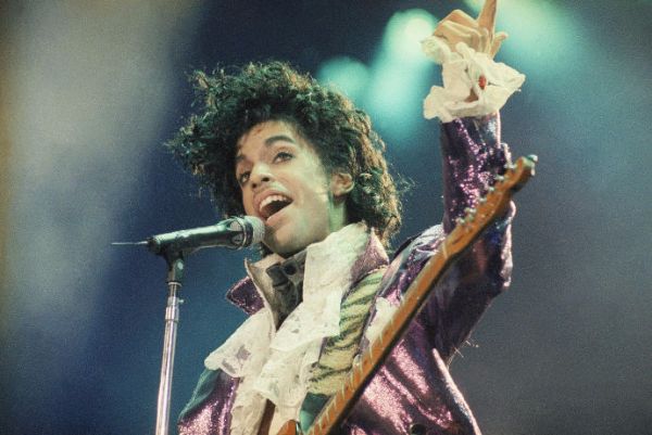 Rock singer Prince performs at the Forum in Inglewood, Calif., during his opening show, Feb. 18, 1985. (AP Photo/Liu Heung Shing)