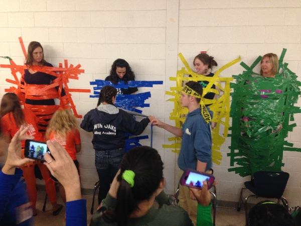 For the Spirit Week Lunch Game on Thursday for Kingdom Day, students bought Tape to tape a teacher to the wall 