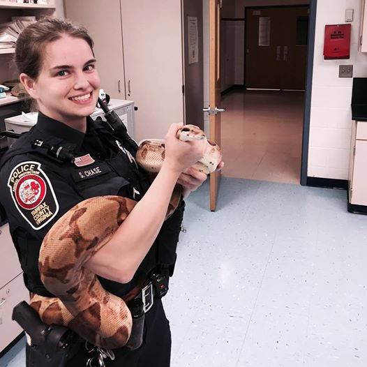 Officer Chase holding the large snake
