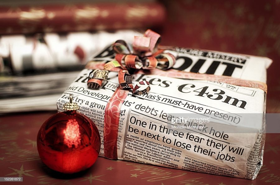 Christmas gift wrapped in newspaper.