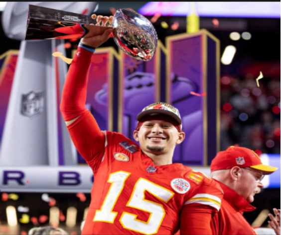 Chiefs QB Patrick Mahomes hoists the Lombardi Trophy after his Super Bowl 58 win. Image via People