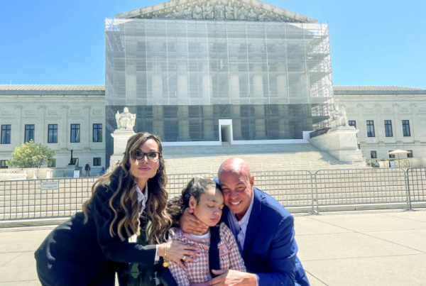 Gina Tharpe (left) pictured beside Ava Tharpe (middle) and Aaron Tharpe (left) in front of the Supreme Court on April 28th, via EducationWeek
